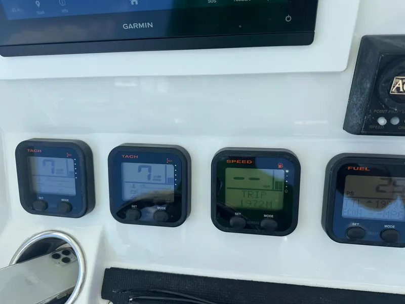 Slide: The Image of Dashboard of a 2009 Regulator 32FS boat with Garmin display and gauges. - 5