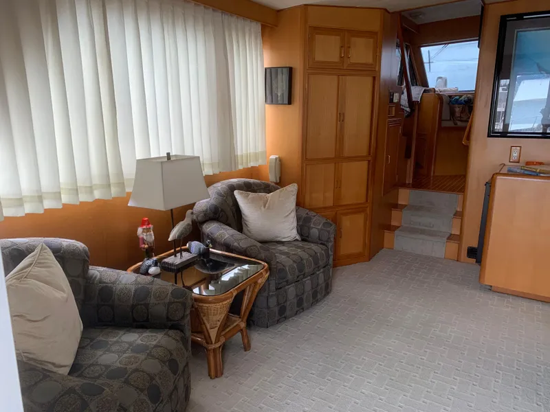 Slide: The Image of Interior of 1997 Ocean Alexander 548 yacht with cozy seating and elegant decor. - 15