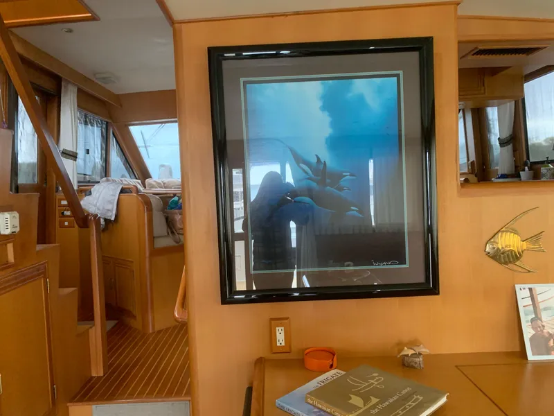 Slide: The Image of Interior of 1997 Ocean Alexander 548 yacht with framed artwork and wooden furnishings. - 18