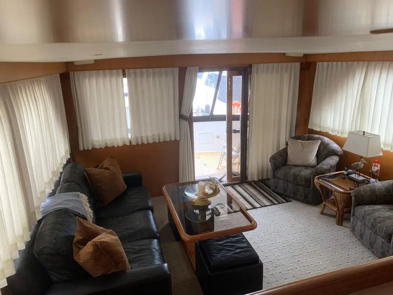 Slide: The Image of Luxurious interior of 1997 Ocean Alexander 548 yacht with cozy seating and elegant decor. - 19