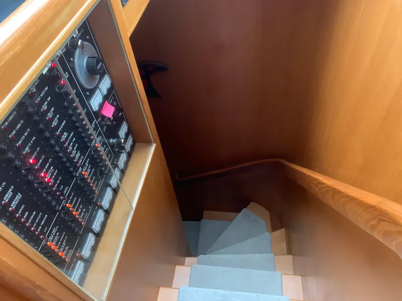 Slide: The Image of Staircase and control panel inside 1997 Ocean Alexander 548 yacht. - 20