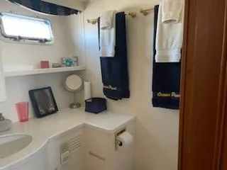 Slide: The Image of Bathroom interior of 1997 Ocean Alexander 548 yacht with towels and vanity. - 25