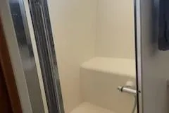 Slide: The Image of Shower area in 1997 Ocean Alexander 548 yacht, featuring a sleek, modern design. - 26