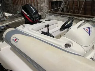 Slide: The Image of 1997 Ocean Alexander 548 boat with Mercury engine, docked in a rustic boathouse. - 43
