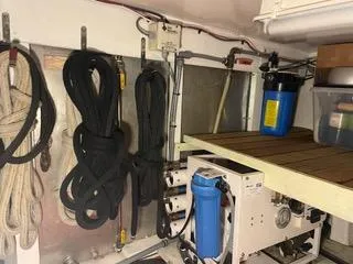 Slide: The Image of Engine room of 1997 Ocean Alexander 548 yacht with ropes and filtration system. - 44