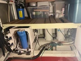 Slide: The Image of Engine room of 1997 Ocean Alexander 548 yacht with water filtration system and storage. - 45