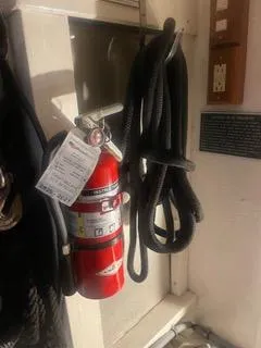 Slide: The Image of Fire extinguisher and ropes on 1997 Ocean Alexander 548 yacht interior. - 47