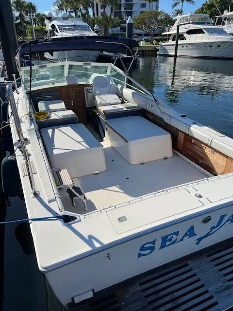 Slide: The Image of 1984 Bertram Express Moppie boat docked at marina. - 36