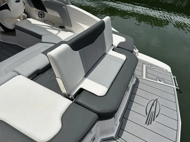 Slide: The Image of 2023 Chaparral 23 SSi boat with sleek seating and stylish deck design. - 3