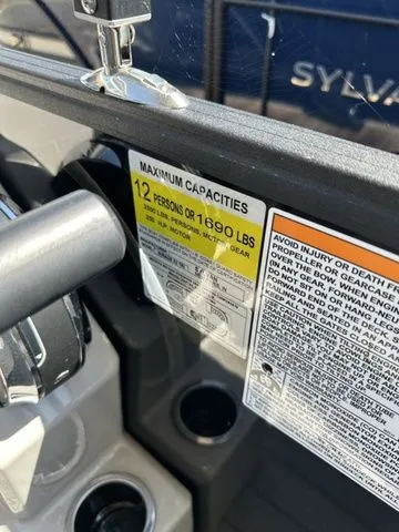 Slide: The Image of 2023 Sylvan Mirage X3 boat capacity label, maximum 12 persons or 1690 lbs. - 5