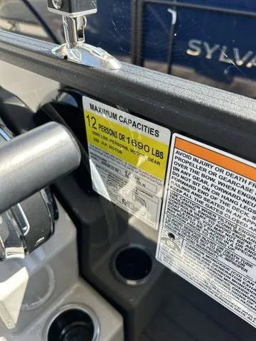 Slide: The Image of 2023 Sylvan Mirage X3 capacity label, maximum 12 persons or 1690 lbs. - 5