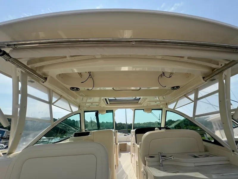 Slide: The Image of 2025 Grady-White Freedom 375 boat interior with spacious seating and modern design. - 11