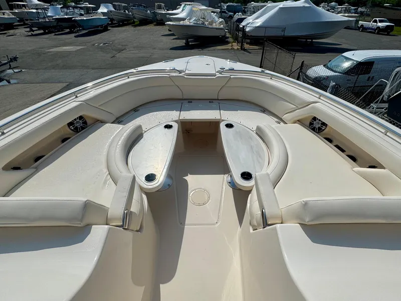 Slide: The Image of 2025 Grady-White Freedom 375 boat interior with spacious seating and cup holders. - 15