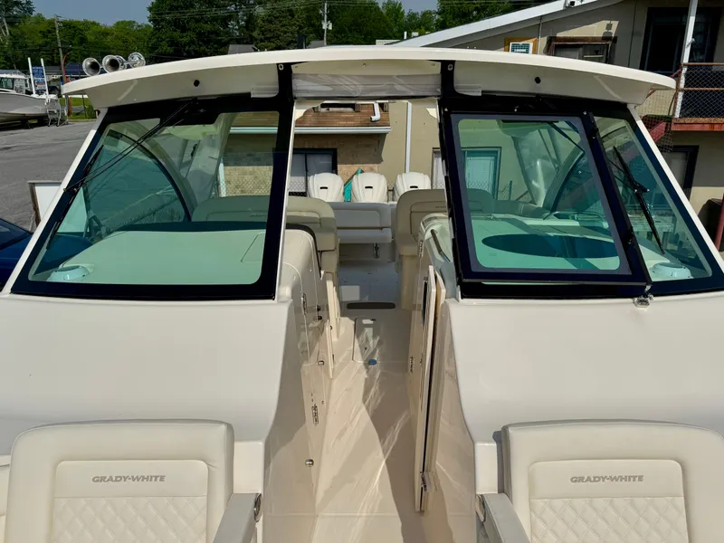 Slide: The Image of 2025 Grady-White Freedom 375 boat interior with seating and windshield view. - 16