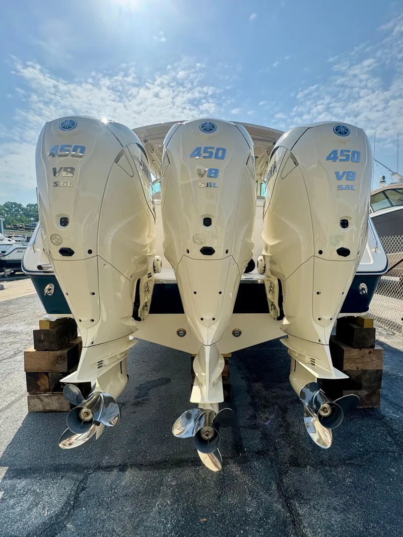 Slide: The Image of 2025 Grady-White Freedom 375 with triple 450 V8 engines, rear view. - 4