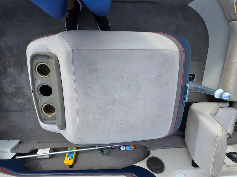 Slide: The Image of 1996 MasterCraft ProStar 190 boat interior with cup holders and seating. - 14