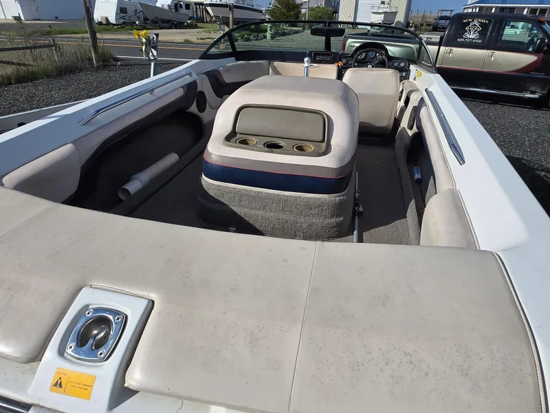 Slide: The Image of 1996 MasterCraft ProStar 190 boat interior with beige seating and dashboard. - 3