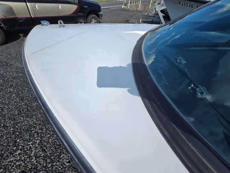 Slide: The Image of 1996 MasterCraft ProStar 190 boat, white exterior, parked on gravel. - 5