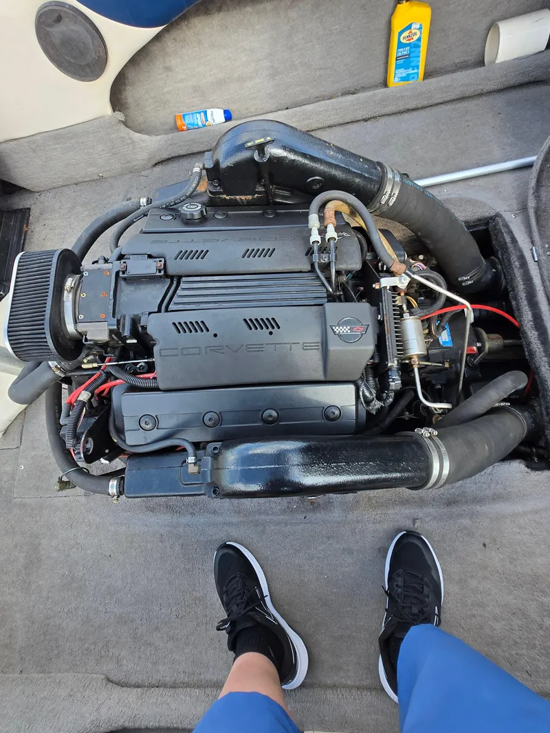 Slide: The Image of 1996 MasterCraft ProStar 190 engine, detailed view, with surrounding boat interior. - 7