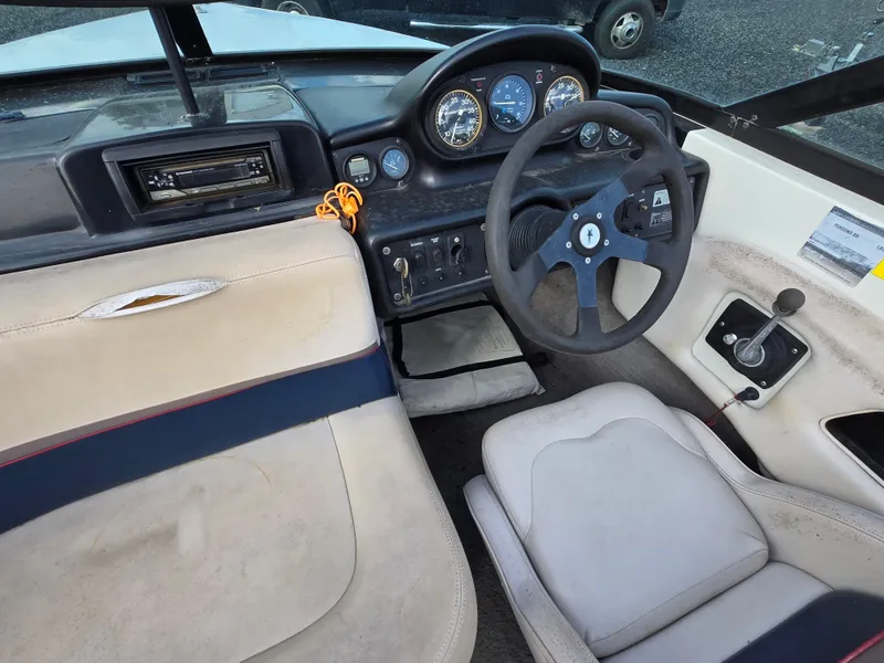 Slide: The Image of 1996 MasterCraft ProStar 190 boat interior with steering wheel and dashboard controls. - 8