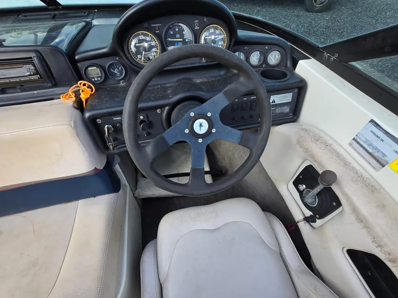 Slide: The Image of 1996 MasterCraft ProStar 190 boat dashboard with steering wheel and gauges. - 9
