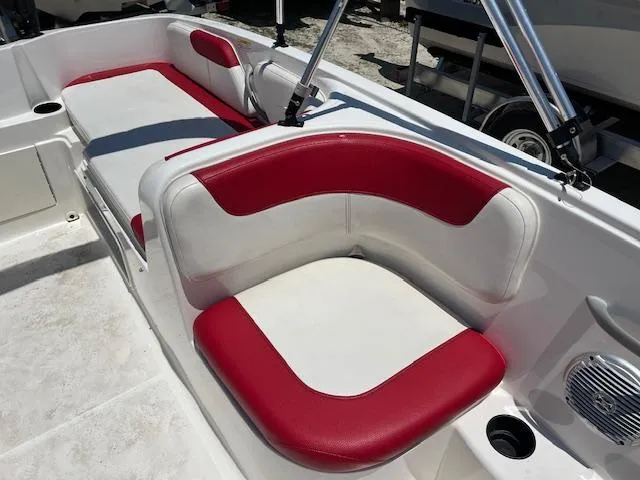 Slide: The Image of 2016 Bayliner Element XL boat interior with red and white seating. - 3
