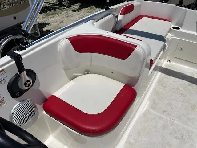 Slide: The Image of 2016 Bayliner Element XL boat interior with red and white seating. - 4