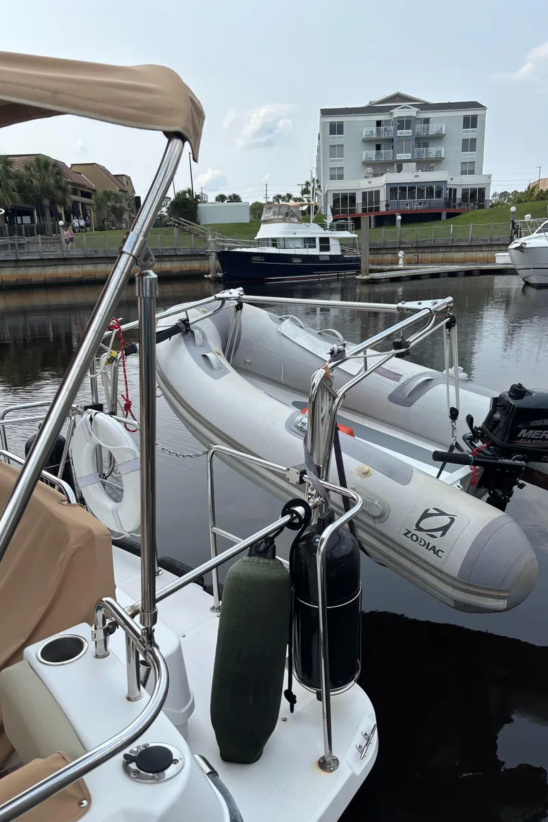 Slide: The Image of 2019 Ranger Tugs R-29 CB docked with inflatable Zodiac boat in marina. - 22