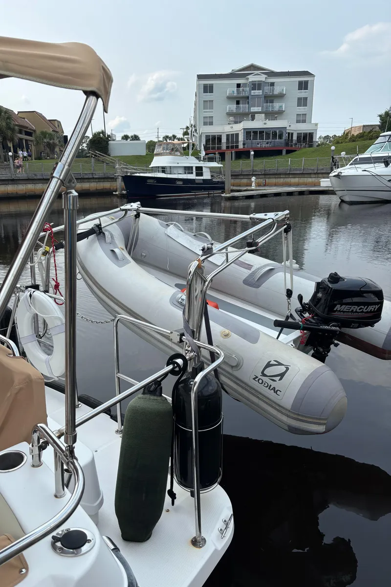 Slide: The Image of 2019 Ranger Tugs R-29 CB docked with inflatable Zodiac boat in marina. - 23