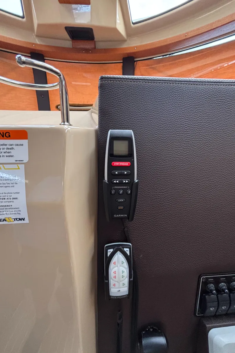 Slide: The Image of Control panel of 2019 Ranger Tugs R-29 CB boat with remote devices. - 28