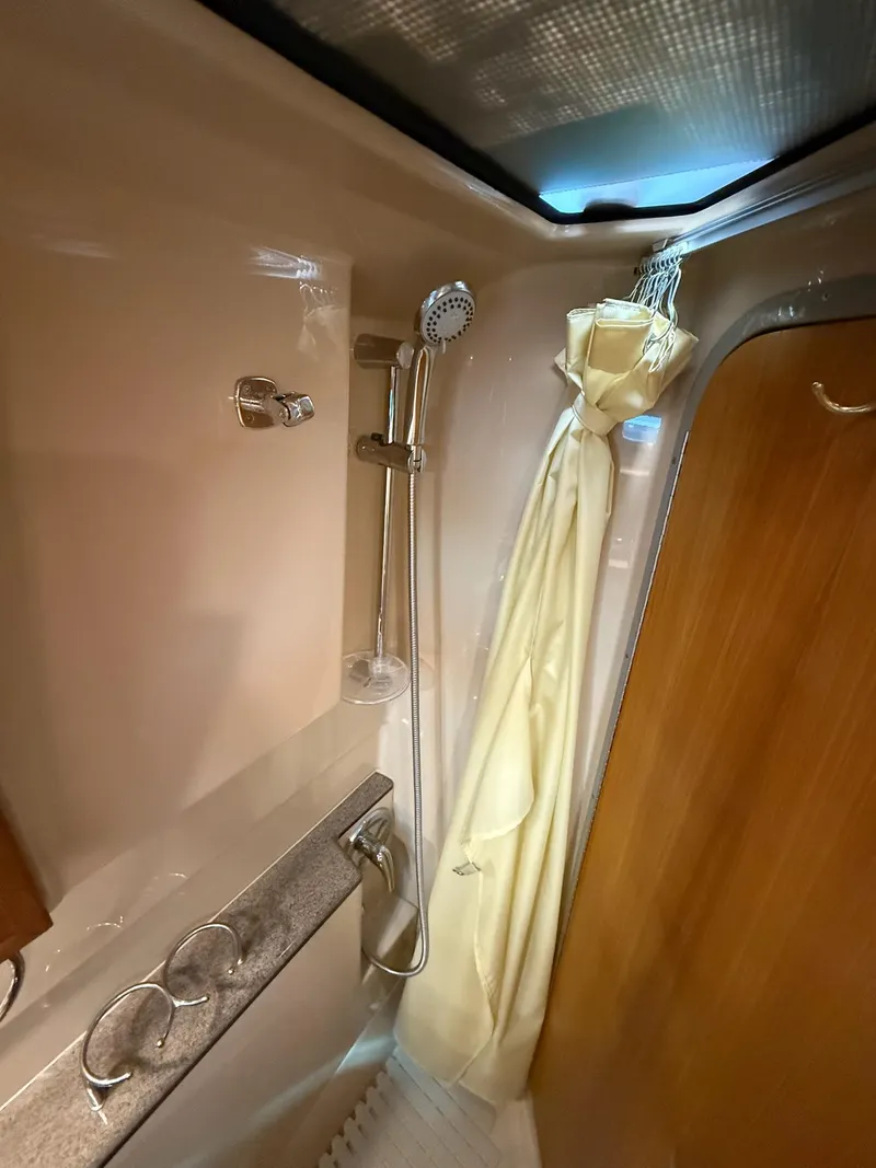 Slide: The Image of 2019 Ranger Tugs R-29 CB bathroom with shower and curtain. - 40