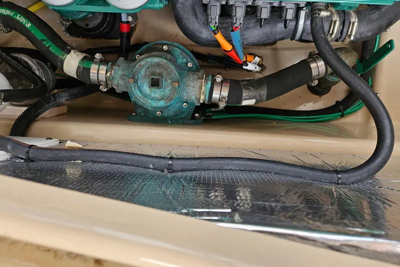 Slide: The Image of Engine compartment of 2019 Ranger Tugs R-29 CB with visible hoses and components. - 46