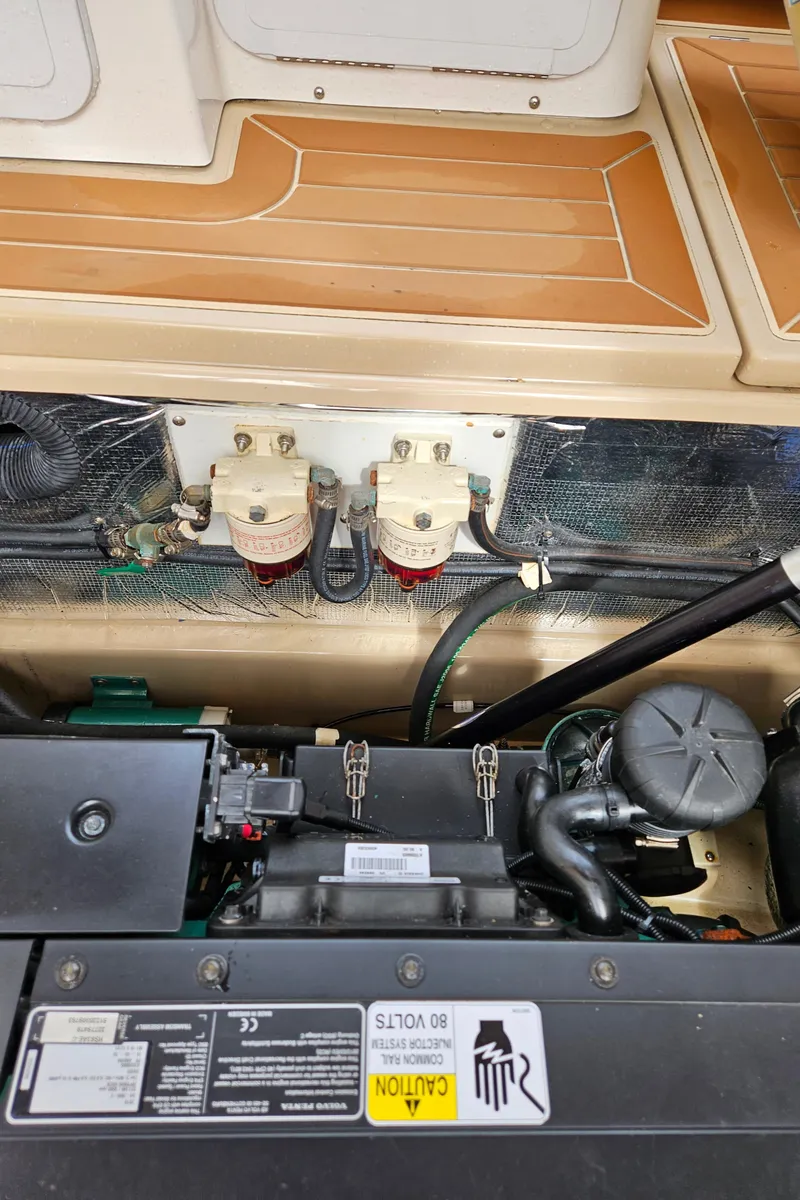 Slide: The Image of Engine compartment of 2019 Ranger Tugs R-29 CB with visible components and wiring. - 47
