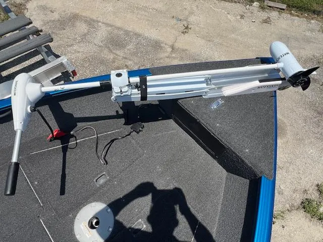 Slide: The Image of 2022 Lund 1650 Angler SS boat with mounted trolling motor on deck. - 10