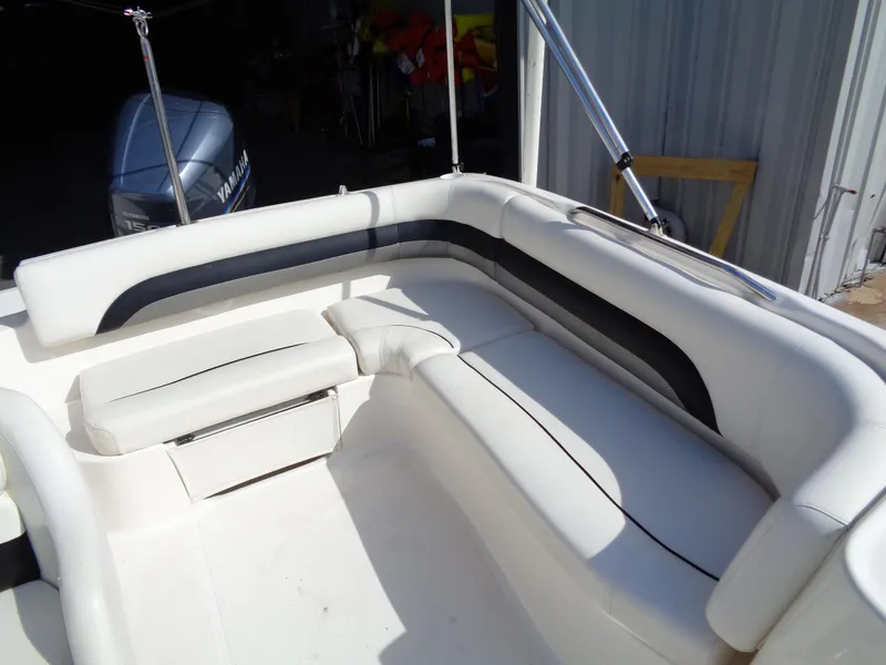 Slide: The Image of 2010 Hurricane FunDeck GS 188 OB boat with white seating and Yamaha outboard motor. - 11