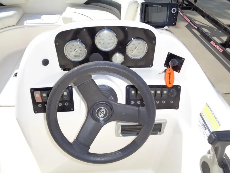 Slide: The Image of Steering console of 2010 Hurricane FunDeck GS 188 OB boat with gauges and controls. - 12