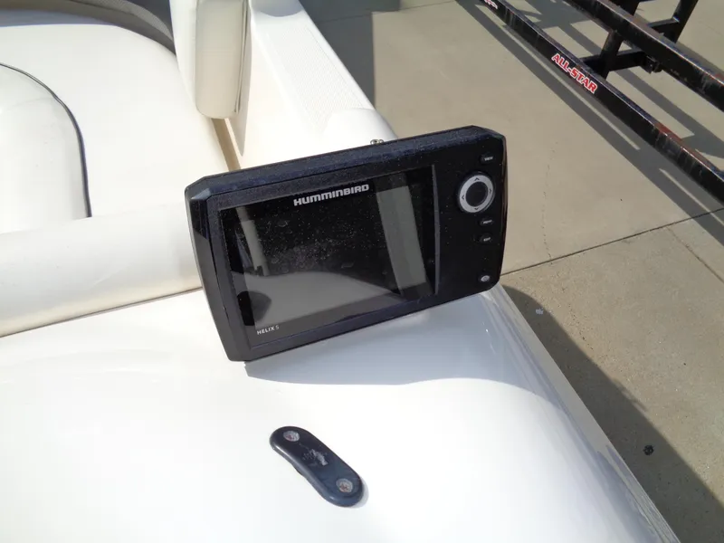 Slide: The Image of Fishfinder on 2010 Hurricane FunDeck GS 188 OB boat, displayed on white seating. - 16