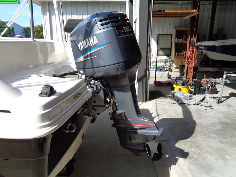 Slide: The Image of 2010 Hurricane FunDeck GS 188 OB with Yamaha outboard motor in a garage setting. - 22