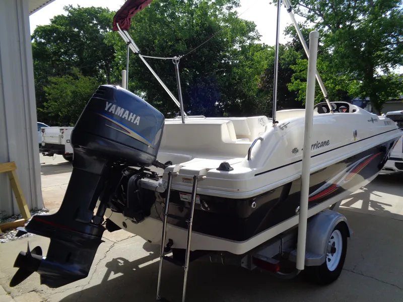 Slide: The Image of 2010 Hurricane FunDeck GS 188 OB boat with Yamaha outboard motor on trailer. - 4