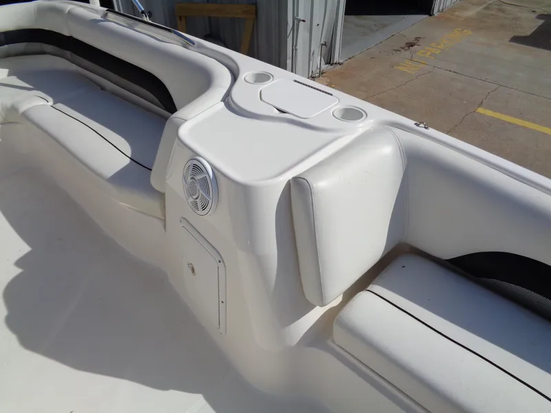 Slide: The Image of 2010 Hurricane FunDeck GS 188 OB boat interior with seating and cup holders. - 9