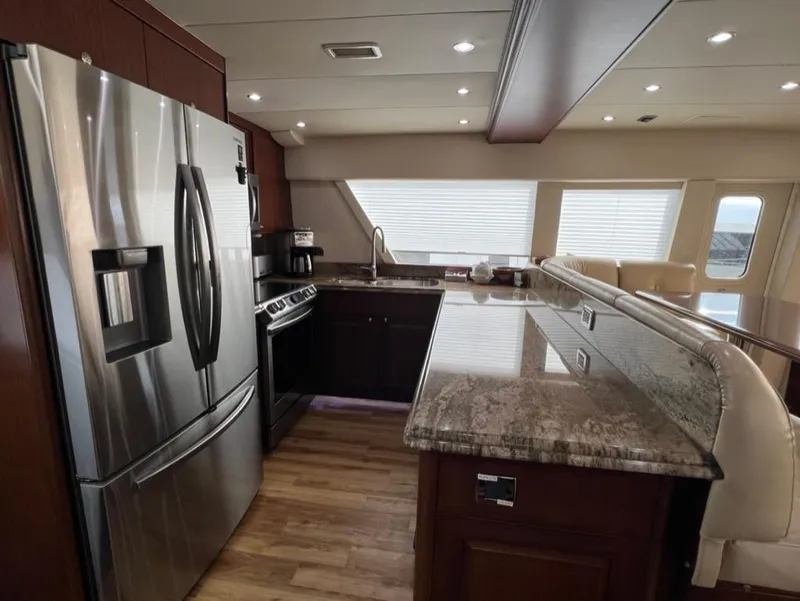 Slide: The Image of Luxurious kitchen interior of 2005 Pacific Mariner 85 yacht with stainless steel appliances. - 13