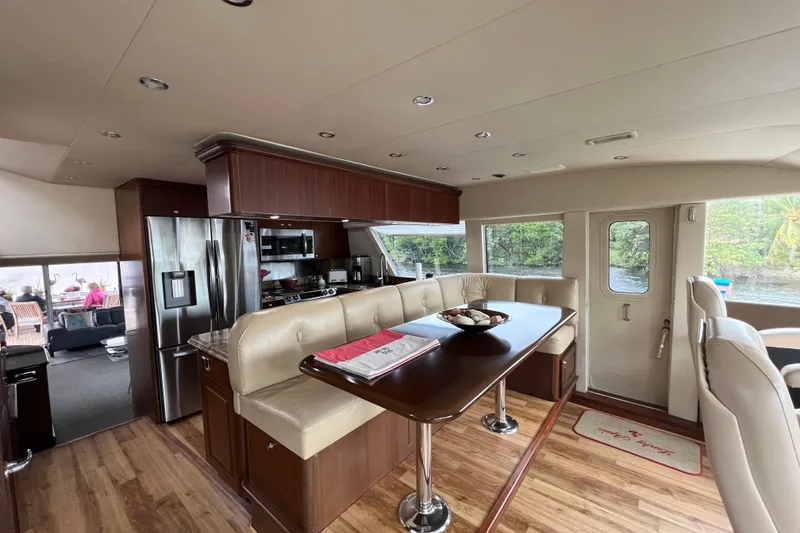 Slide: The Image of Luxurious interior of 2006 Pacific Mariner 85 yacht with modern kitchen and dining area. - 14