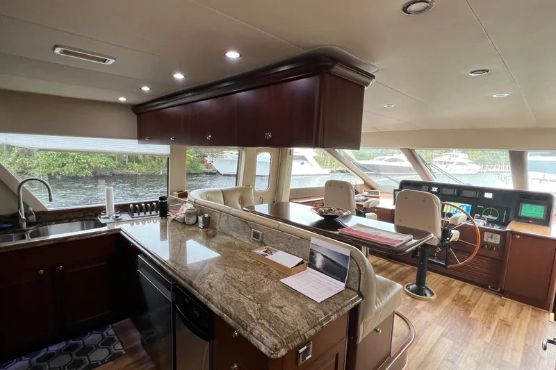 Slide: The Image of Luxurious interior of 2006 Pacific Mariner 85 yacht with modern kitchen and helm station. - 15