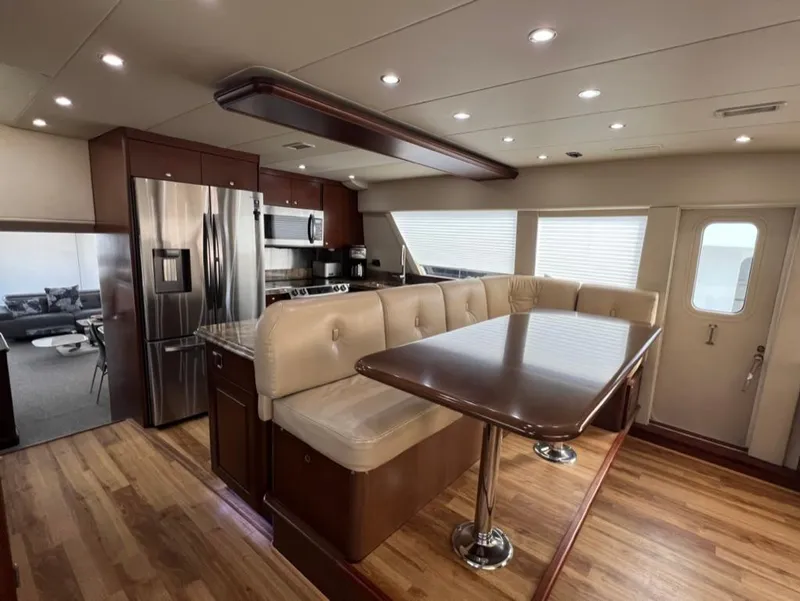 Slide: The Image of Luxurious 2005 Pacific Mariner 85 yacht interior with modern kitchen and dining area. - 16