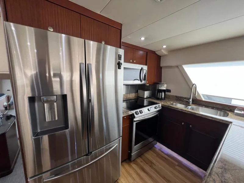 Slide: The Image of Luxurious kitchen in 2005 Pacific Mariner 85 yacht with stainless steel appliances. - 17