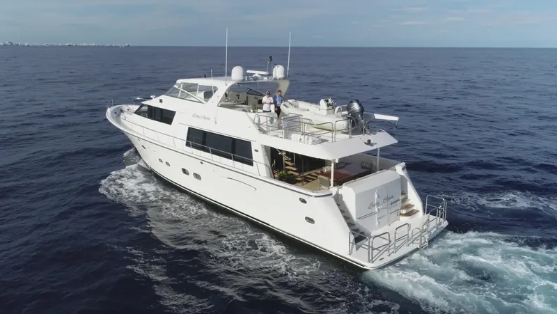 Slide: The Image of 2005 Pacific Mariner 85 yacht cruising on open sea under clear skies. - 2