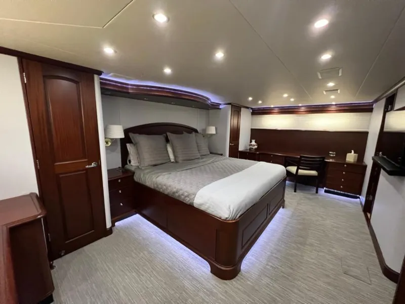Slide: The Image of Luxurious bedroom interior of 2005 Pacific Mariner 85 yacht with elegant wood finishes. - 33