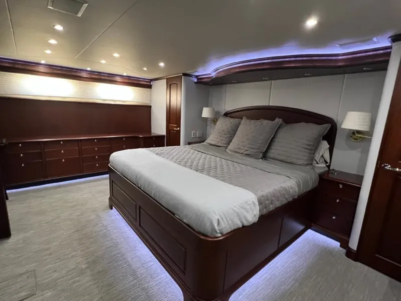 Slide: The Image of Luxurious bedroom in 2005 Pacific Mariner 85 yacht with elegant wood finishes and ambient lighting. - 34