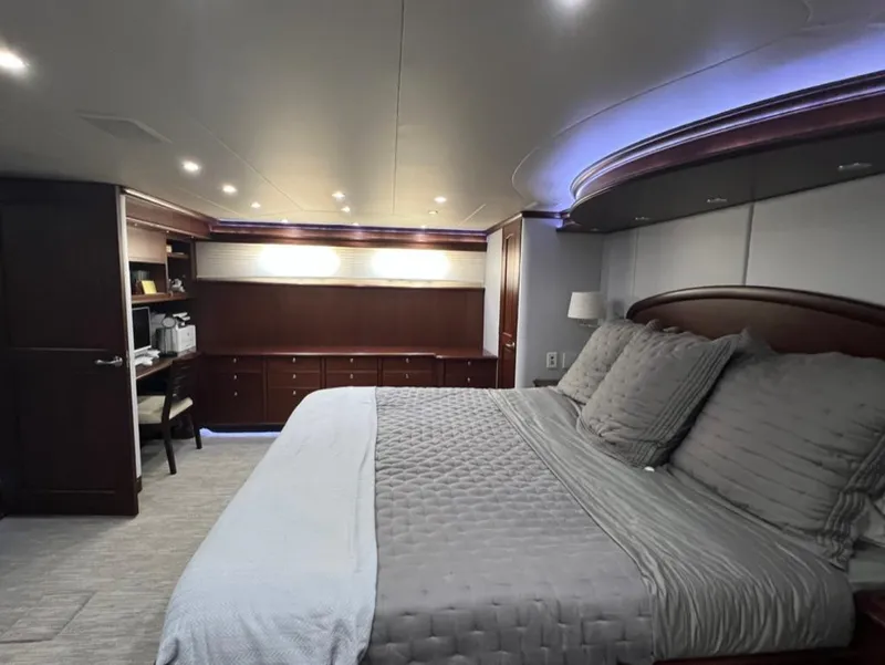 Slide: The Image of Luxurious bedroom interior of a 2005 Pacific Mariner 85 yacht with elegant bedding and ambient lighting. - 35
