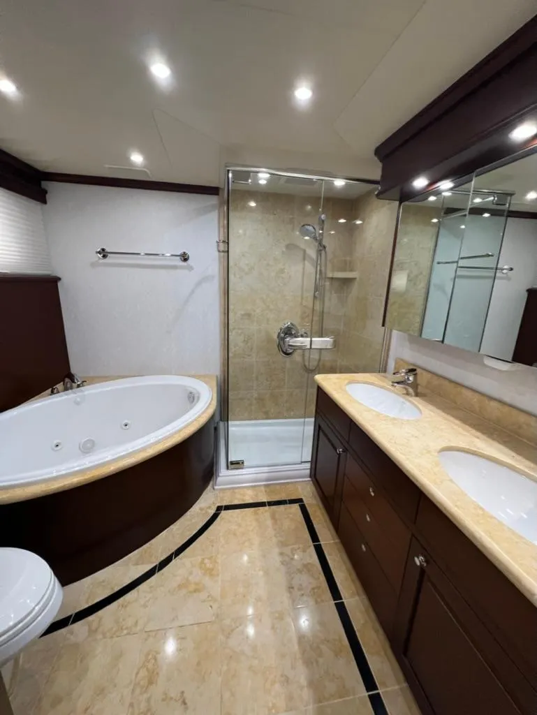 Slide: The Image of Luxurious bathroom in 2005 Pacific Mariner 85 yacht with jacuzzi, shower, and dual sinks. - 37